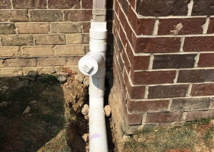 connecting downspout to drainage